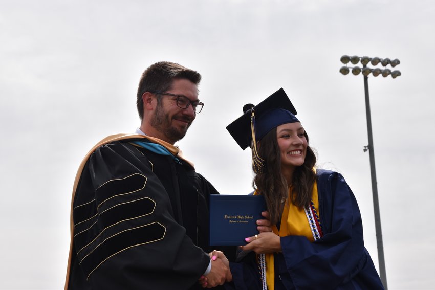 Principal Fox was giving Salutatorian Ashley Livingston her diploma. She's going to school at Colorado State University to study Construction Management and Engineering.